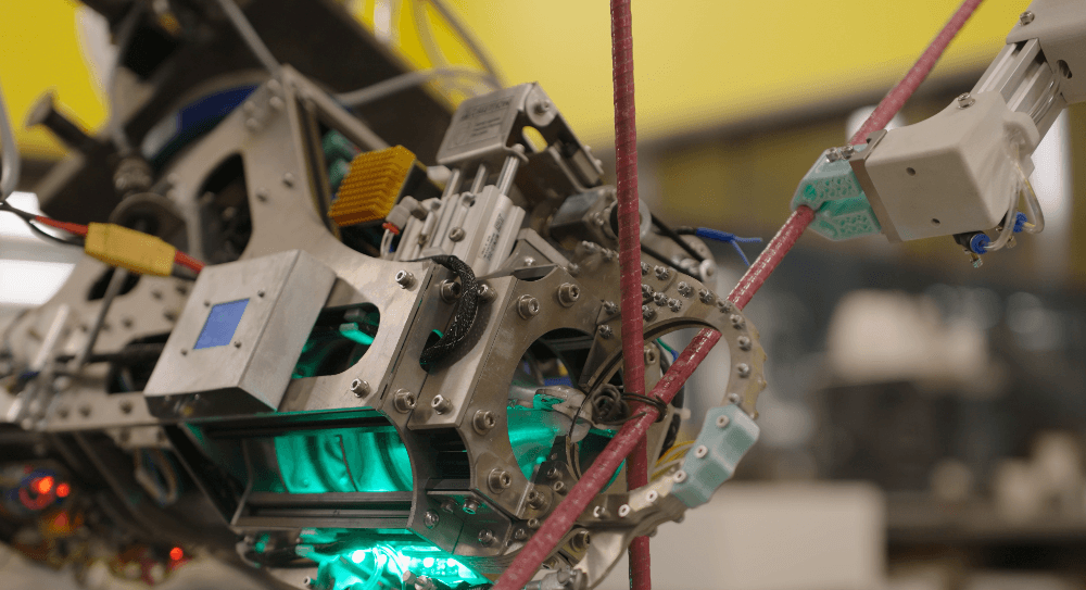 Robotic wire tying assembly